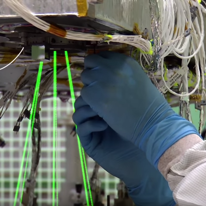 hands adjusting laser